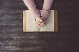 Woman praying on table